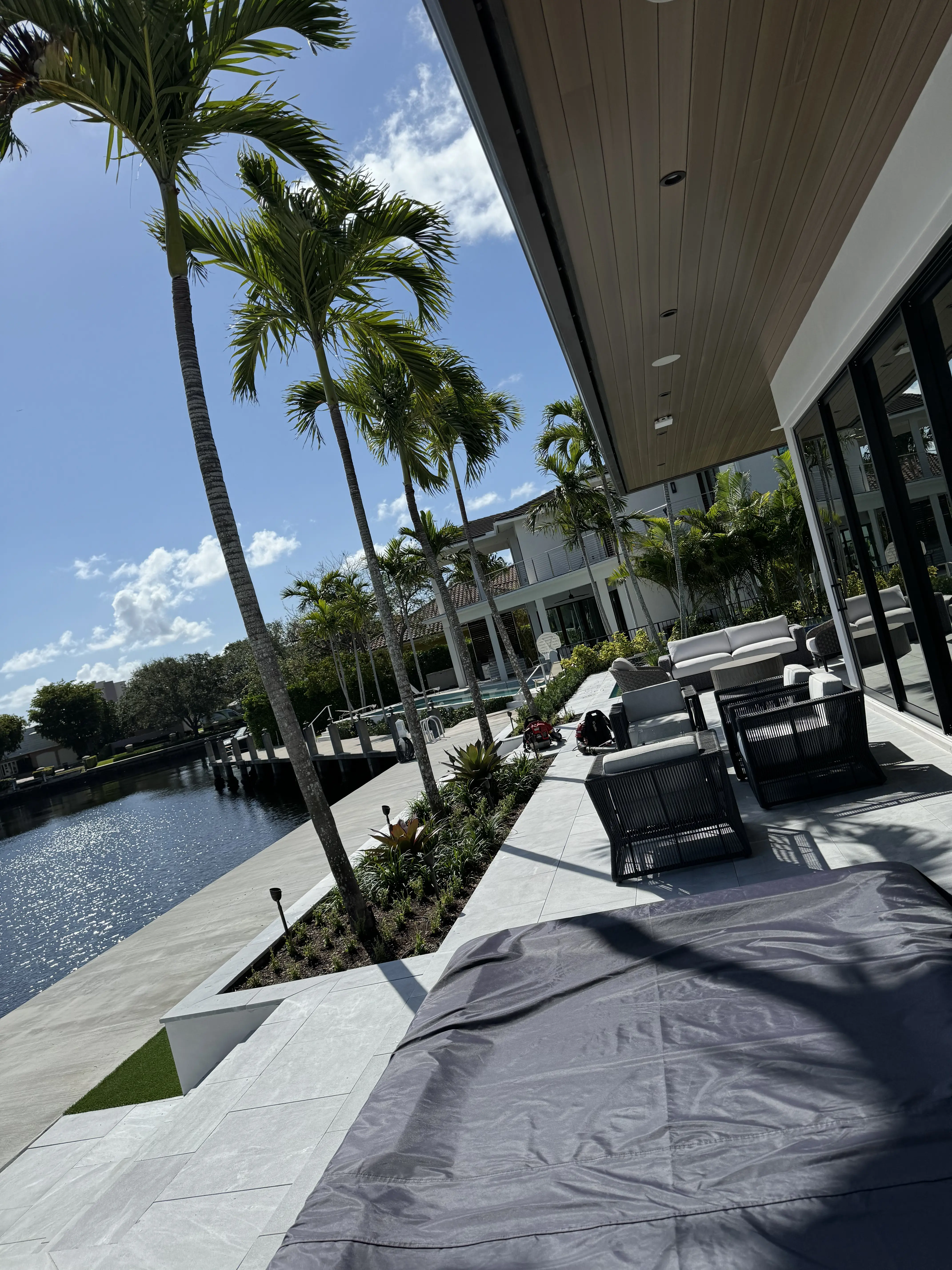 Manicured palms and hedges along a Pompano Beach waterfront
